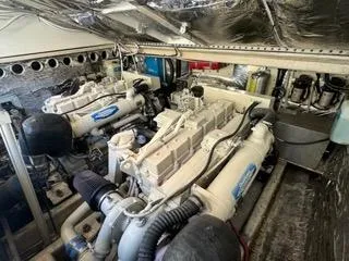 Slide: The Image of Engine room of a 2001 Carolina Classic 35 boat, showcasing dual engines. - 26