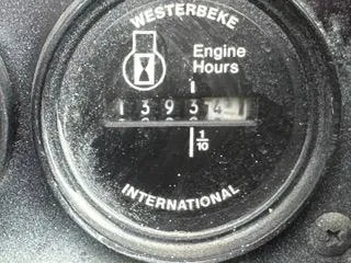 Slide: The Image of Westerbeke engine hour meter showing 1393.4 hours on a 2001 Carolina Classic 35. - 27