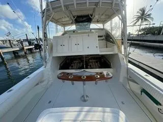 Slide: The Image of 2001 Carolina Classic 35 boat interior with fishing setup at marina. - 6