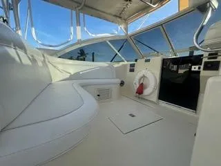 Slide: The Image of Interior view of 2001 Carolina Classic 35 boat with white seating and windows. - 7
