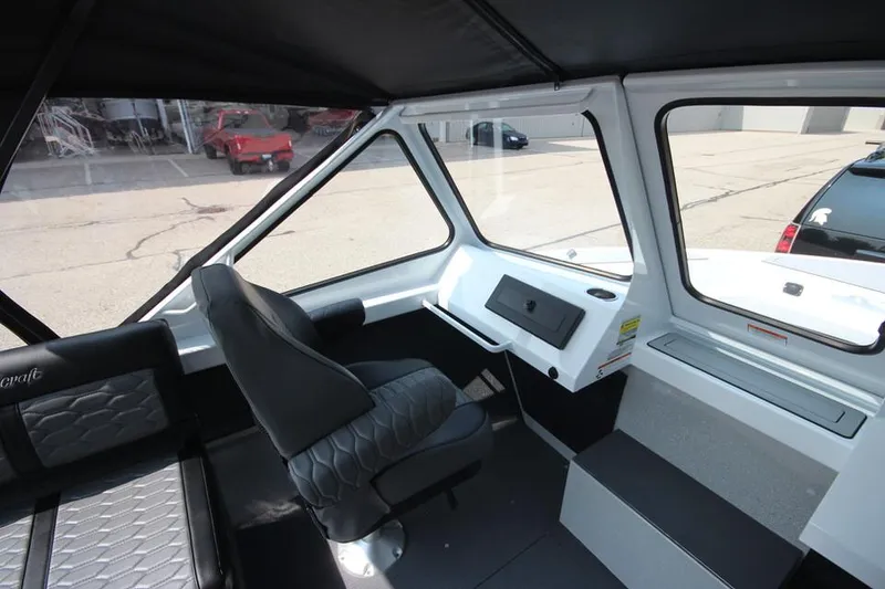 Slide: The Image of 2025 Weldcraft 200 Rebel F150 boat interior with modern seating and dashboard. - 18