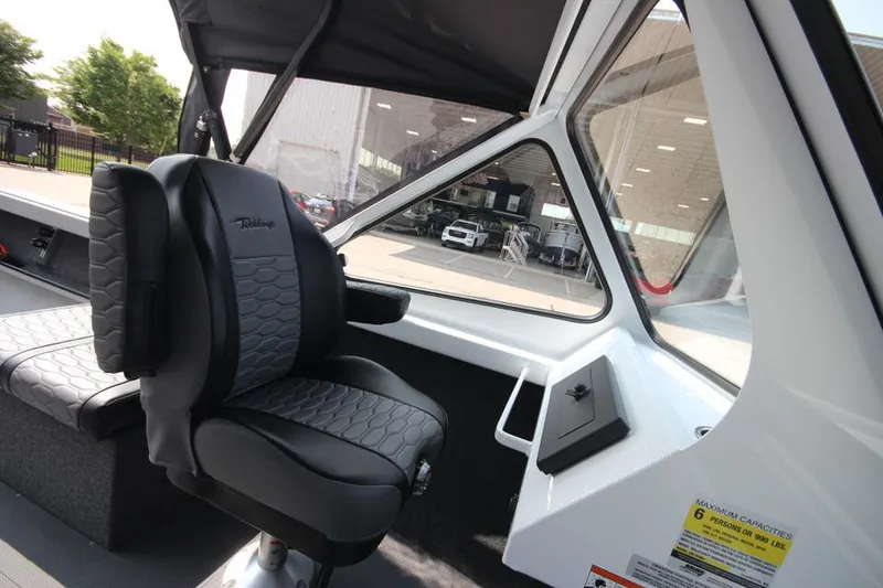 Slide: The Image of Interior of 2025 Weldcraft 200 Rebel F150 boat with deluxe seating. - 19