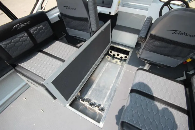 Slide: The Image of Interior of 2025 Weldcraft 200 Rebel F150 boat with seating and storage. - 24