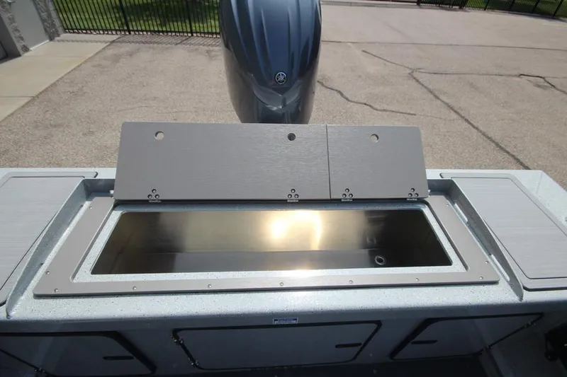 Slide: The Image of 2025 Weldcraft 200 Rebel F150 boat with open storage compartment. - 9
