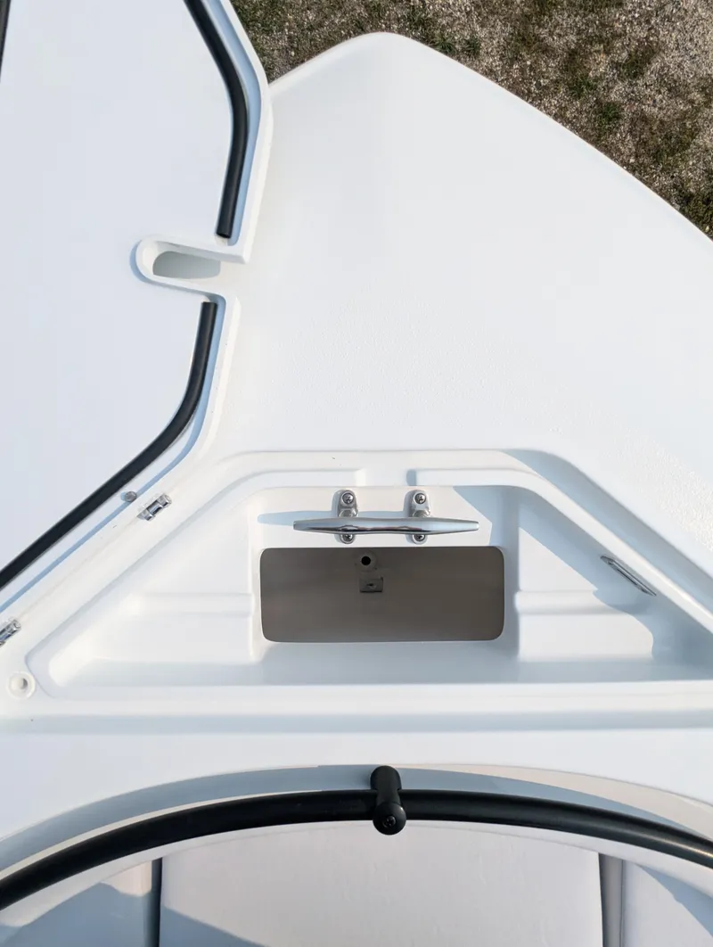 Slide: The Image of 2025 Contender 24 Sport boat deck with storage compartment and hatch. - 11