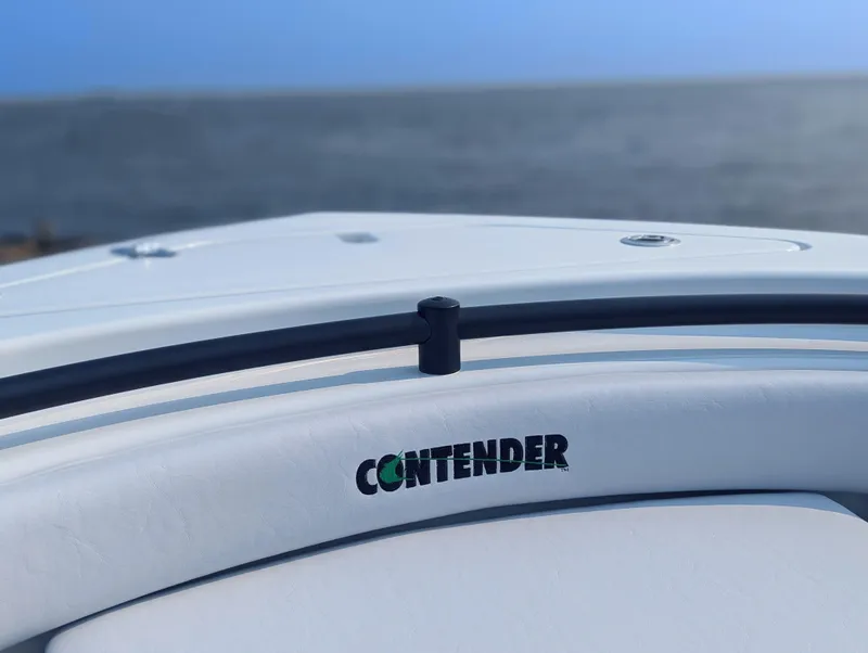 Slide: The Image of 2025 Contender 24 Sport boat bow with ocean backdrop. - 13