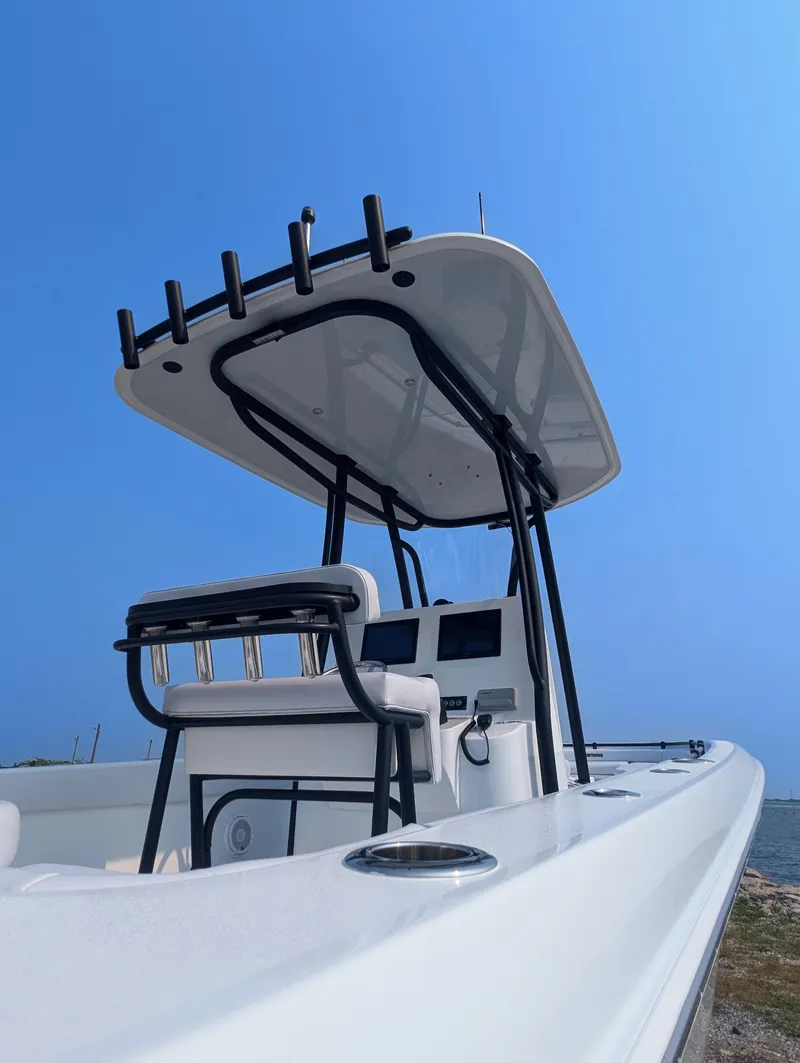 Slide: The Image of 2025 Contender 24 Sport boat with sleek design and modern features. - 26
