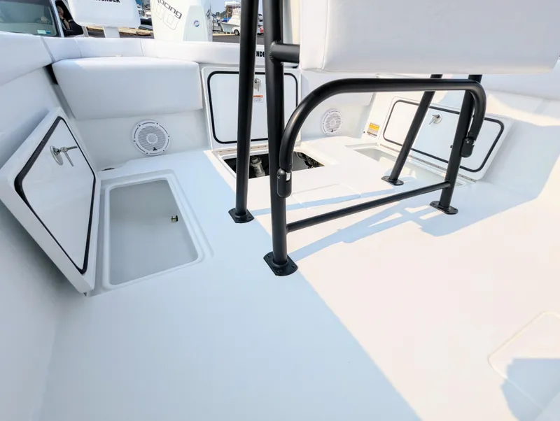 Slide: The Image of 2025 Contender 24 Sport boat interior with storage compartments and seating. - 3