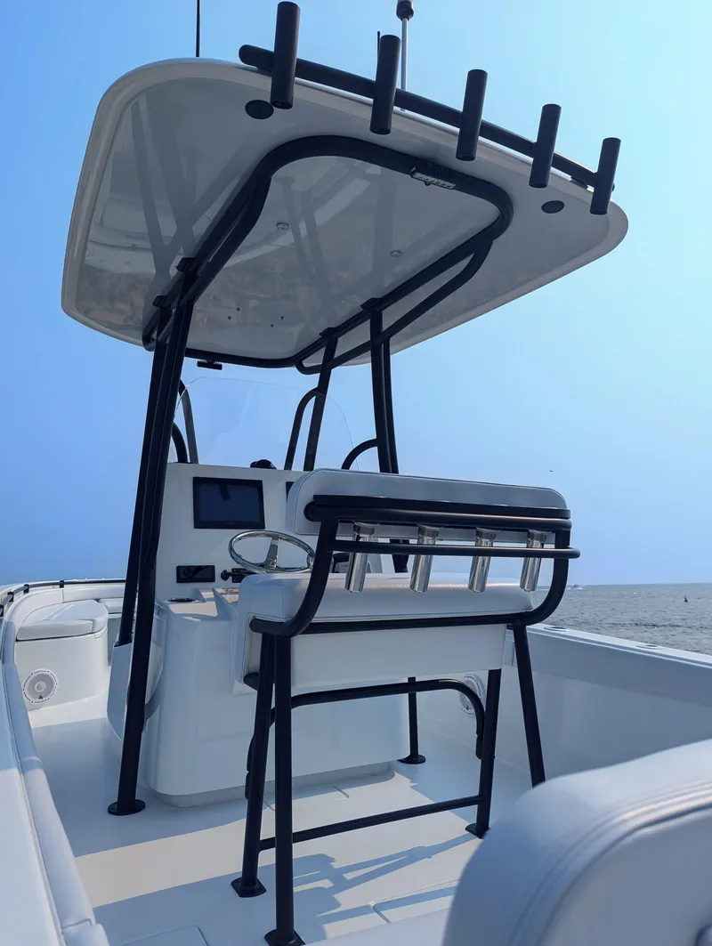 Slide: The Image of 2025 Contender 24 Sport boat with sleek design and modern features on open water. - 31