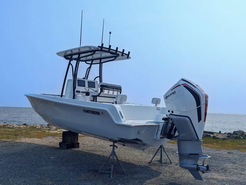 Slide: The Image of 2025 Contender 24 Sport boat on display by the sea. - 33