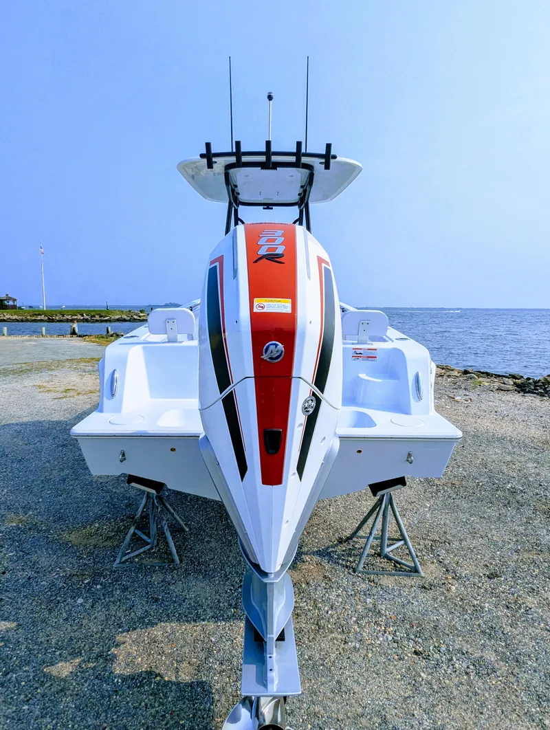 Slide: The Image of 2025 Contender 24 Sport boat on display by the waterfront. - 37