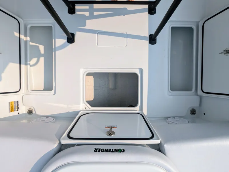 Slide: The Image of 2025 Contender 24 Sport boat interior with storage compartments and sleek design. - 4