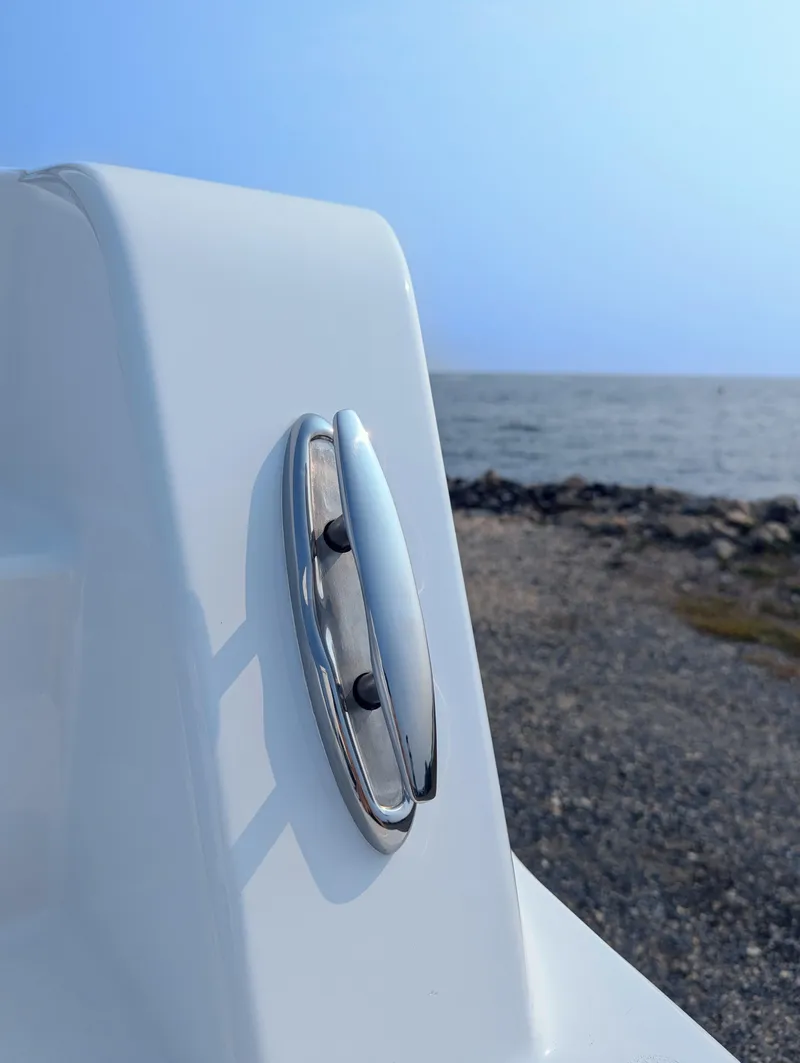 Slide: The Image of 2025 Contender 24 Sport boat detail with ocean backdrop. - 40