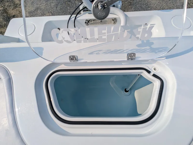 Slide: The Image of Open hatch on 2025 Contender 24 Sport boat, showing interior compartment. - 5