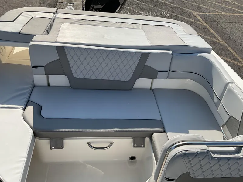 Slide: The Image of 2025 Bayliner VR6 Bowrider OB interior with gray cushioned seating and diamond pattern accents. - 9