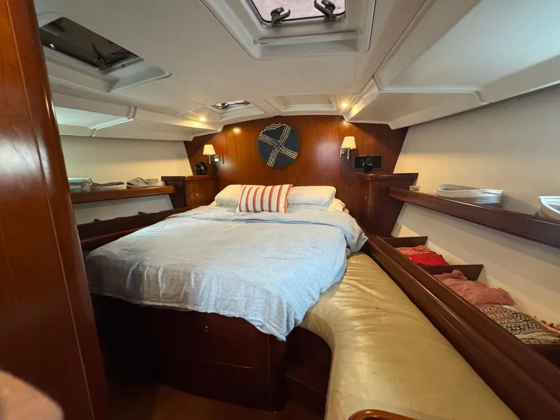 Slide: The Image of Luxurious cabin interior of 2005 Beneteau 523 Oceanis yacht with cozy bed and wooden finish. - 17