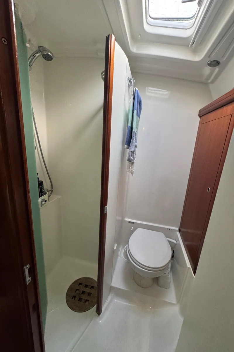 Slide: The Image of Beneteau 523 Oceanis 2005 yacht bathroom with shower, toilet, and skylight. - 20