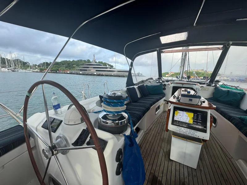 Slide: The Image of 2005 Beneteau 523 Oceanis yacht cockpit with navigation equipment, docked in a marina. - 22