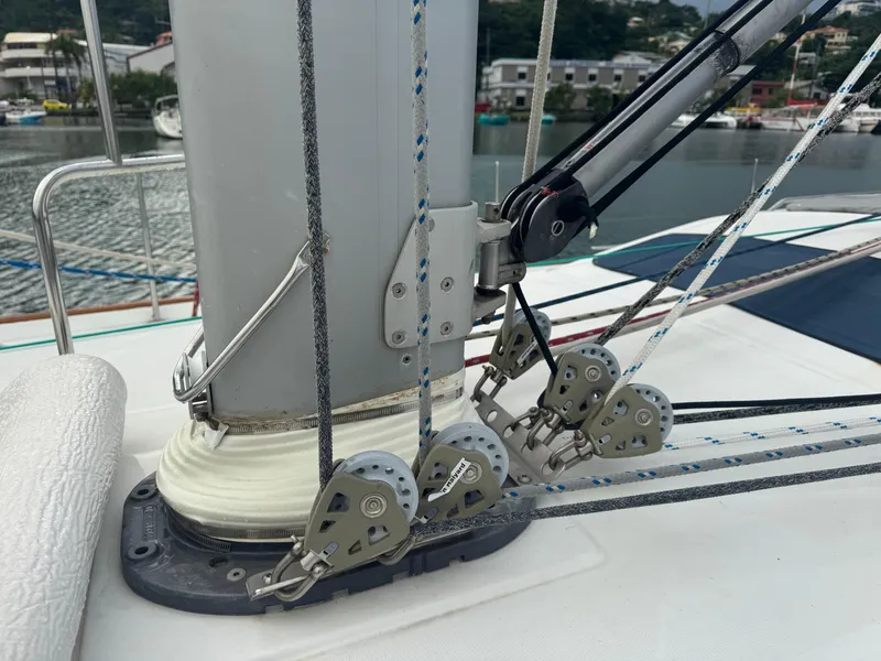 Slide: The Image of Sailing rigging on a 2005 Beneteau 523 Oceanis yacht, featuring pulleys and ropes. - 26