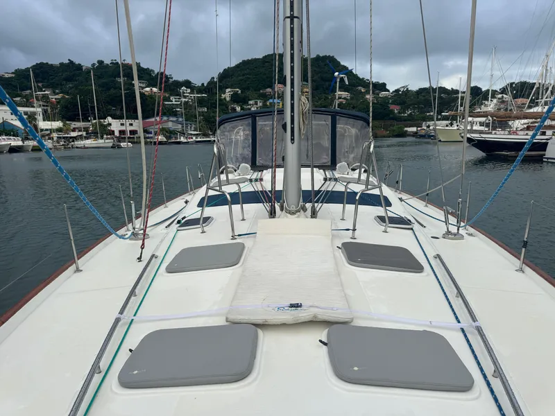 Slide: The Image of 2005 Beneteau 523 Oceanis sailboat deck with marina and hills in background. - 27