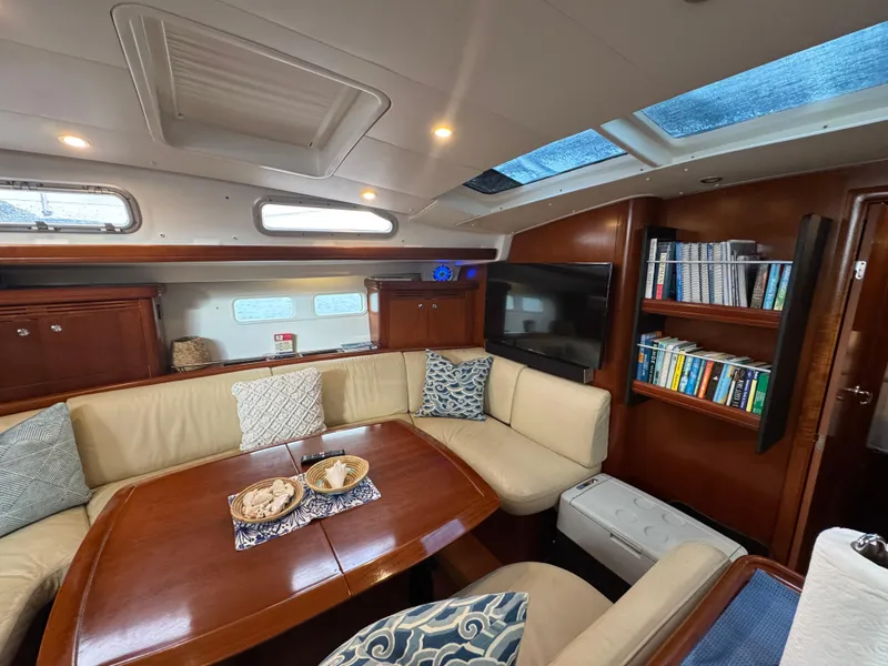 Slide: The Image of Luxurious interior of 2005 Beneteau 523 Oceanis yacht with plush seating and wooden finishes. - 8