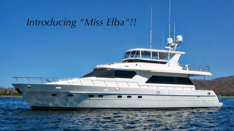 Slide: The Image of 2004 Grand Harbour Motor Yacht "Miss Elba" on water under clear blue sky. - 0