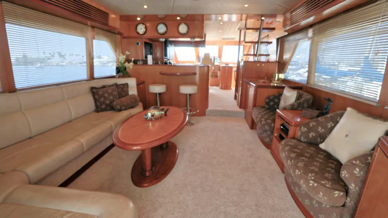 Slide: The Image of Luxurious 2004 Grand Harbour motor yacht interior with elegant seating and wooden accents. - 1
