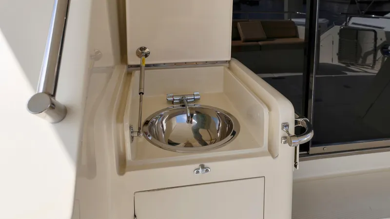 Slide: The Image of Stainless steel sink on 2004 Grand Harbour Motor Yacht deck. - 23