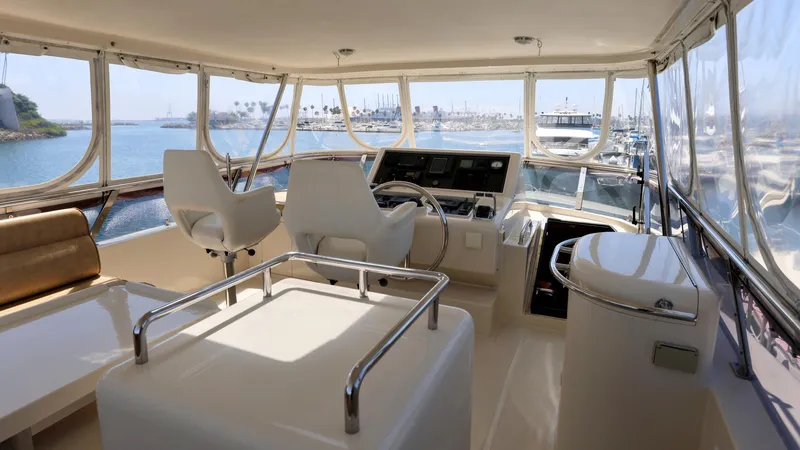 Slide: The Image of Luxurious 2004 Grand Harbour motor yacht interior with panoramic views and modern helm. - 24