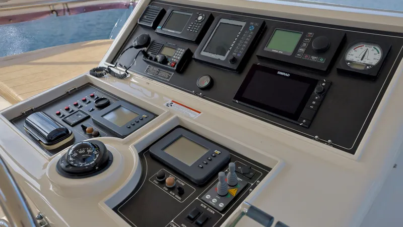 Slide: The Image of Control panel of a 2004 Grand Harbour Motor Yacht with navigation instruments. - 25