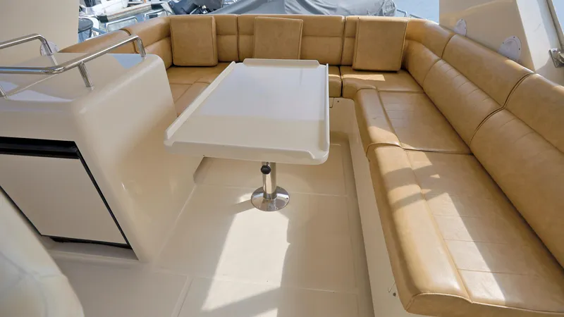 Slide: The Image of Luxurious seating area on 2004 Grand Harbour Motor Yacht with beige leather upholstery. - 27