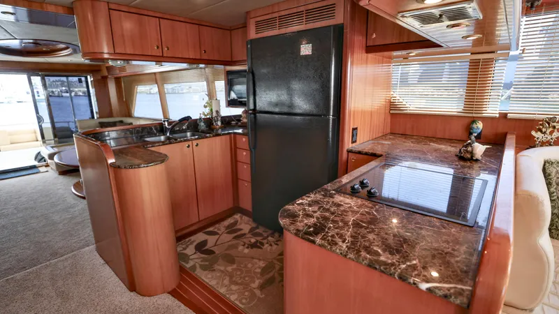 Slide: The Image of Luxurious 2004 Grand Harbour motor yacht kitchen with marble countertops and modern appliances. - 3