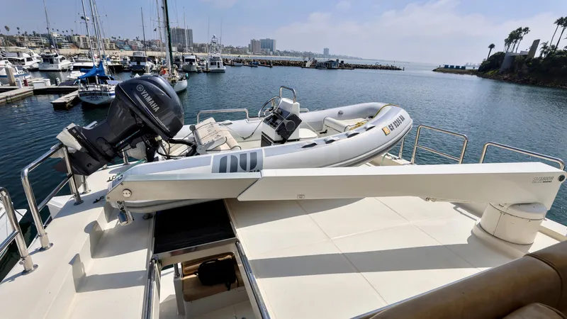 Slide: The Image of Grand Harbour 2004 motor yacht with dinghy on deck, docked in a marina. - 32
