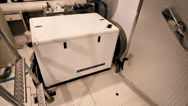 Slide: The Image of Engine room of 2004 Grand Harbour Motor Yacht with equipment and storage. - 38