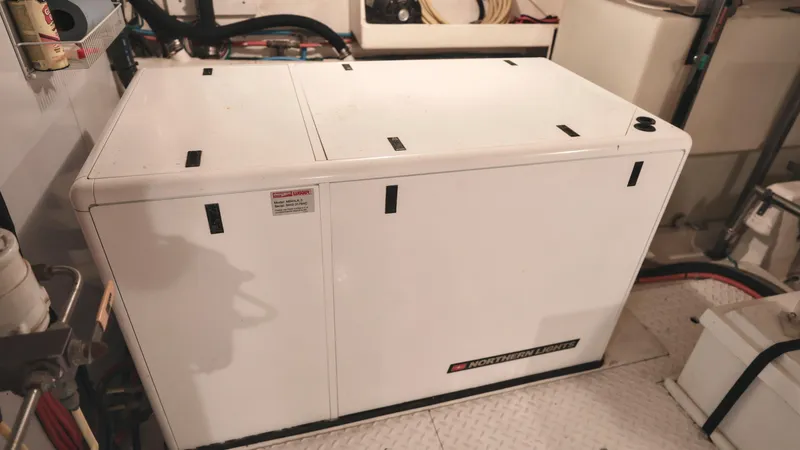 Slide: The Image of Engine room of 2004 Grand Harbour Motor Yacht with generator. - 39