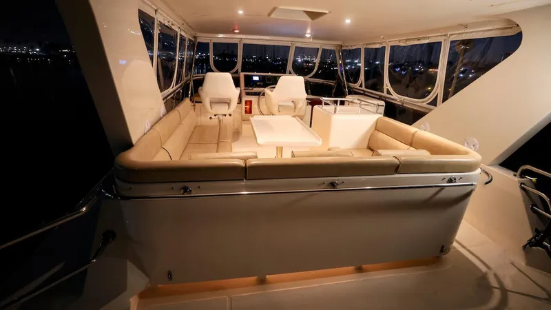 Slide: The Image of Luxurious 2004 Grand Harbour motor yacht interior with elegant seating and panoramic windows. - 47