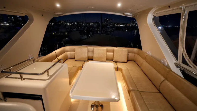 Slide: The Image of Luxurious 2004 Grand Harbour Motor Yacht interior with elegant seating and ambient lighting. - 48