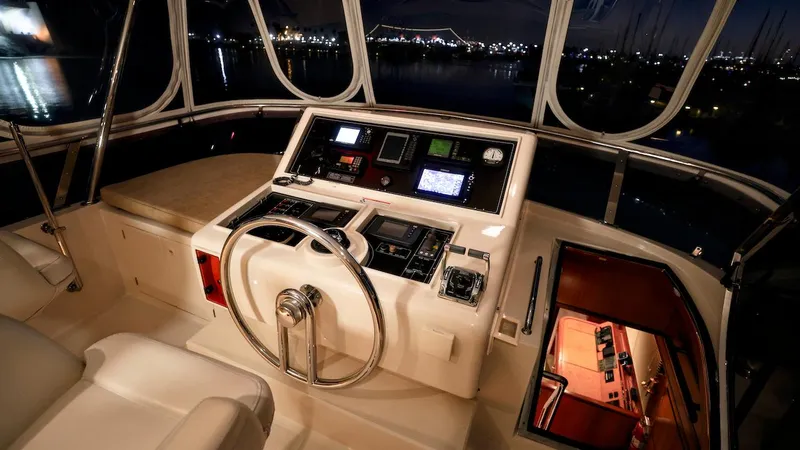 Slide: The Image of Grand Harbour 2004 motor yacht helm with illuminated controls at night. - 49
