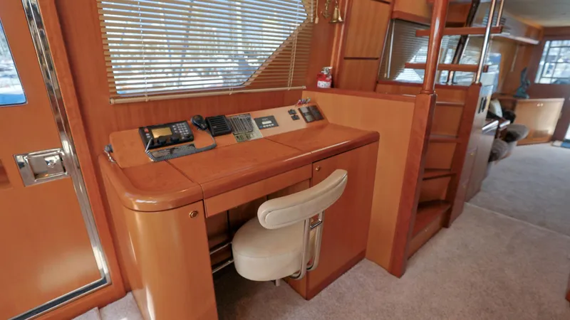 Slide: The Image of Luxurious 2004 Grand Harbour motor yacht interior with wooden desk and chair. - 5