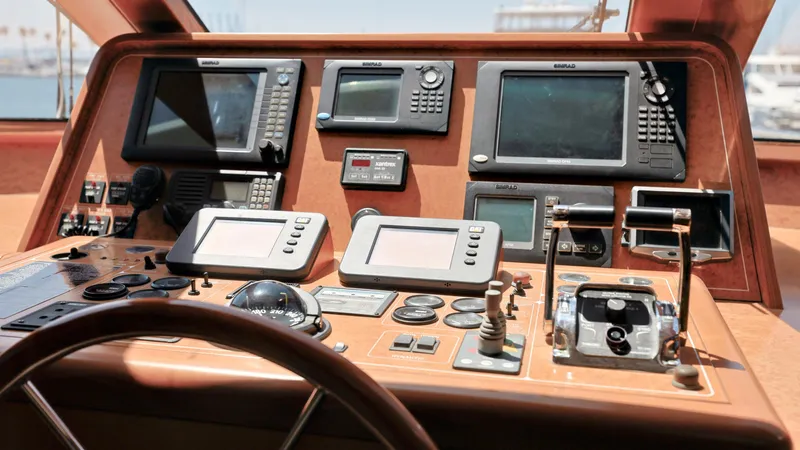 Slide: The Image of Control panel of a 2004 Grand Harbour Motor Yacht with navigation and communication equipment. - 8