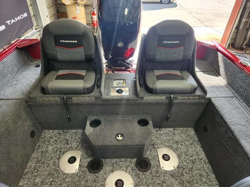 Slide: The Image of 2025 Tracker Pro Guide™ V-175 Combo boat interior with dual seats and carpeted flooring. - 12