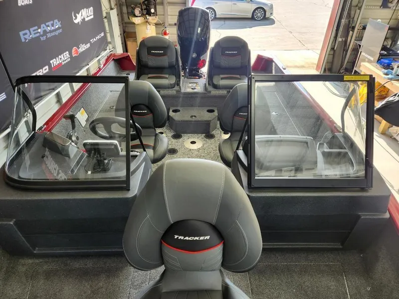 Slide: The Image of 2025 Tracker Pro Guide V-175 Combo boat interior with seating and windshield. - 8