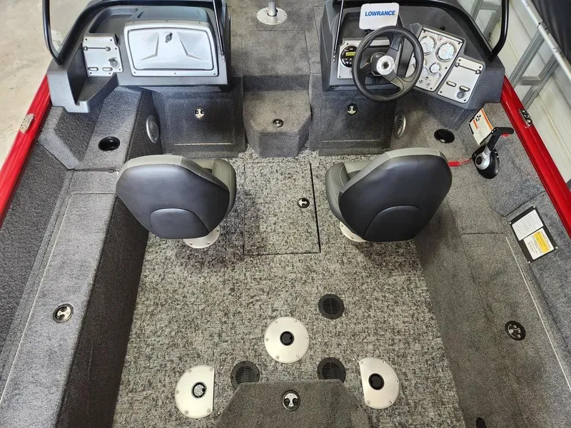 Slide: The Image of 2025 Tracker Pro Guide™ V-175 Combo boat interior with dual seats and steering console. - 9