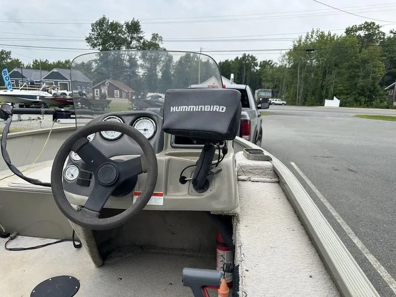 Slide: The Image of 2007 Lowe FM 165 boat interior with steering wheel and Humminbird fish finder. - 8