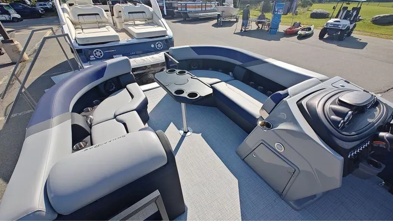 Slide: The Image of 2025 South Bay S224E 3.0 pontoon boat interior with seating and control console. - 5