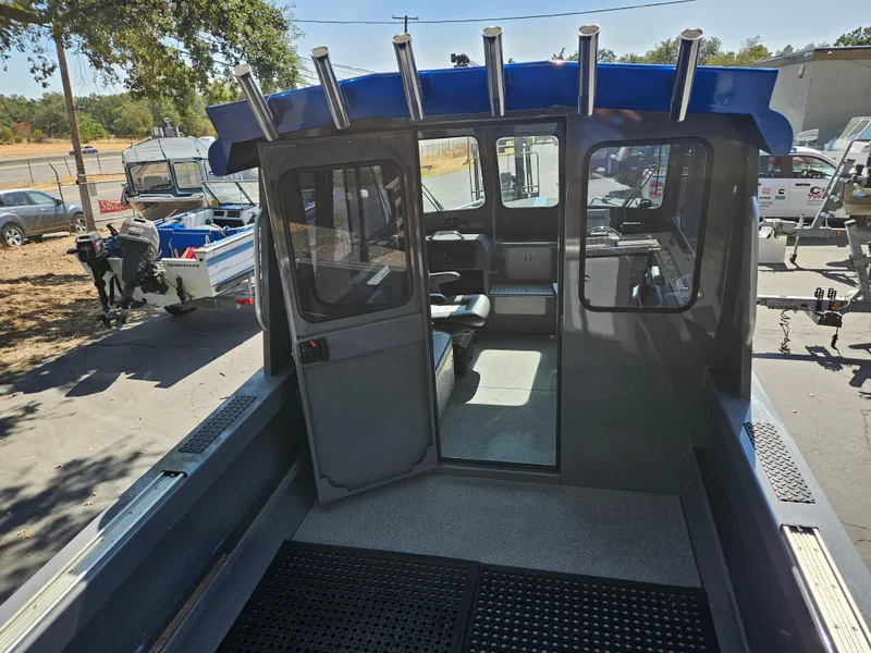 Slide: The Image of 2022 RH Boats Coastal 22 Hardtop, interior view, parked outdoors. - 5