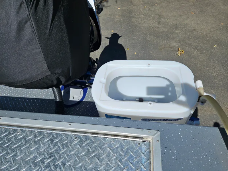 Slide: The Image of RH Boats Coastal 22 Hardtop 2022, deck view with equipment and storage container. - 9
