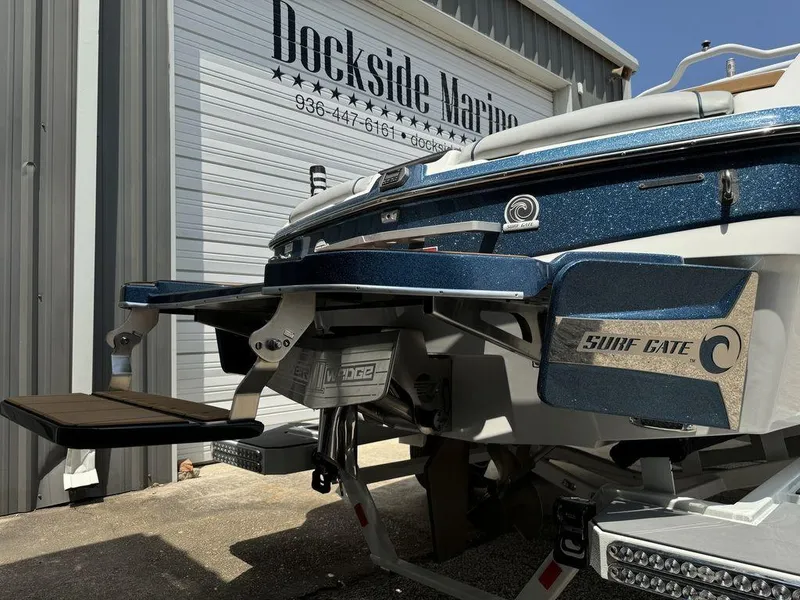 Slide: The Image of 2022 Malibu 23 LSV boat with Surf Gate feature at Dockside Marine. - 4