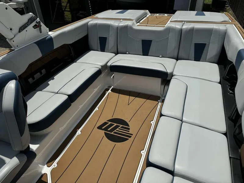 Slide: The Image of 2022 Malibu 23 LSV boat interior with spacious seating and stylish design. - 6