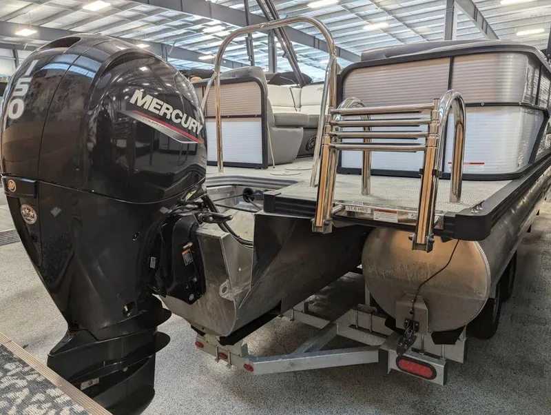 Slide: The Image of 2022 Manitou 23 Aurora LE RF VP pontoon boat with Mercury outboard motor. - 3